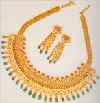 Code KJGJC 2921Gold 22 ktWeight 120 gmsEmerald 27 ctRuby 7 ctDiamond round wt 1ct, click here to see large picture.